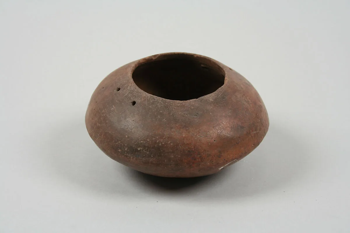 Undecorated lenticular bowl with suspension holes — Unknown