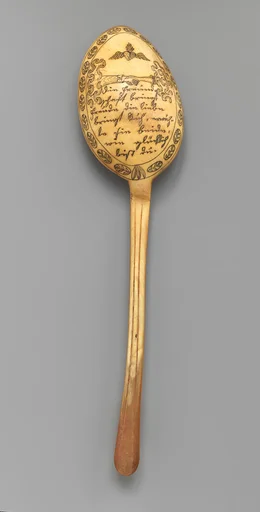 Spoon with flaming heart and romantic inscription
