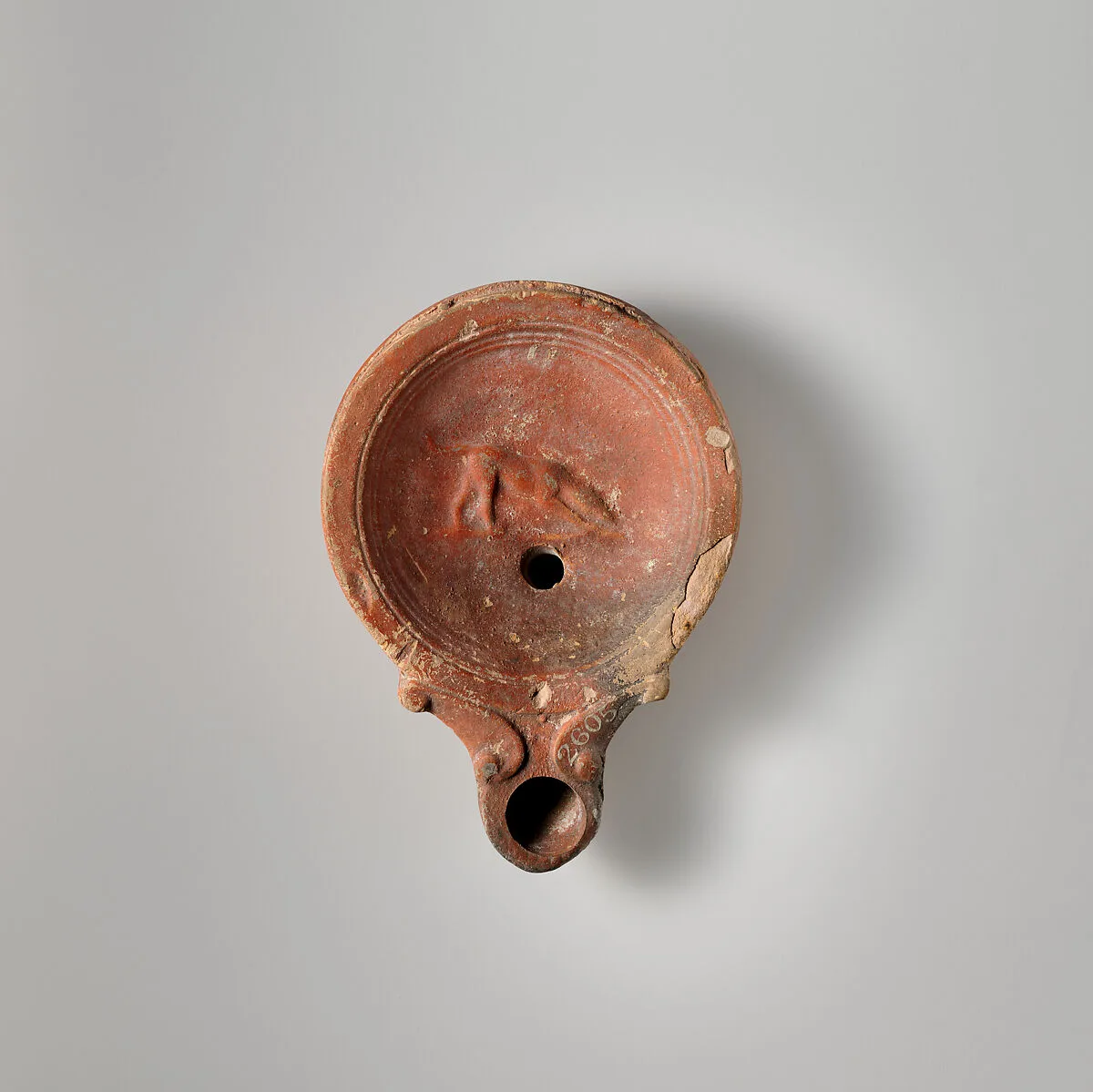 Terracotta oil lamp — Unknown