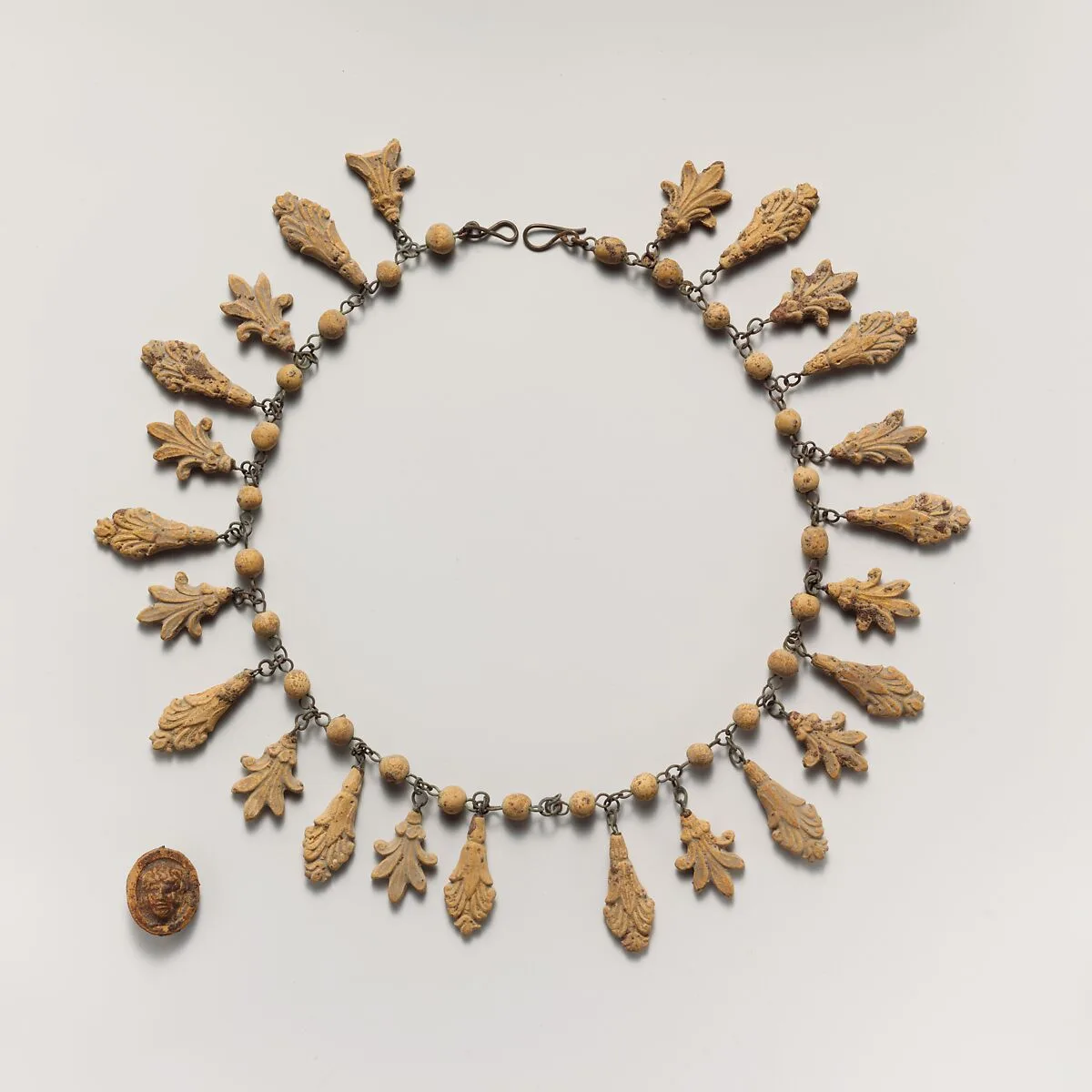 Terracotta necklace with palmette and lotus pendants — Unknown