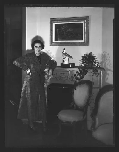 [Unidentified Woman Leaning on Fireplace Mantle]