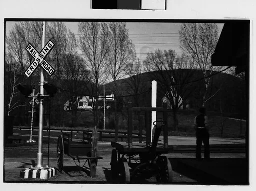 [Two 35mm Film Frames:Railroad Crossing and Flatbed Wagons, Copake, New York]