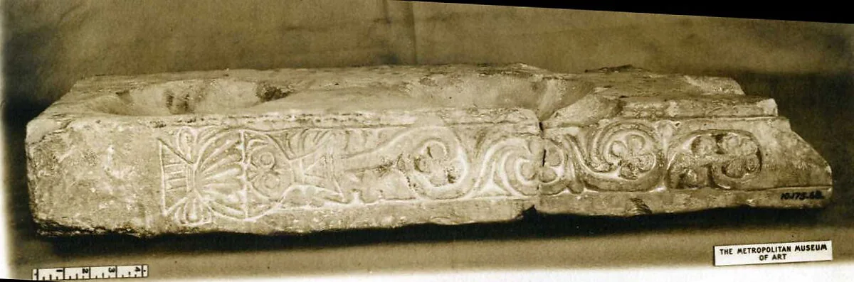 Fragment of a Stand for Water Jars Carved with a Vase and Vegetal Scroll — Unknown