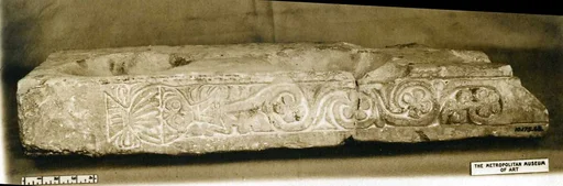 Fragment of a Stand for Water Jars Carved with a Vase and Vegetal Scroll