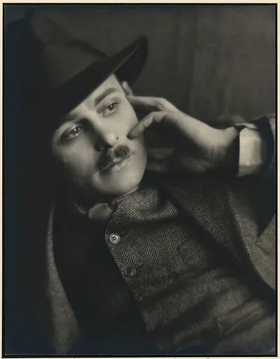 [Man with Hand to Face]