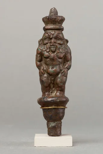 Bes standing on a papyriform capital, Beset on opposite side
