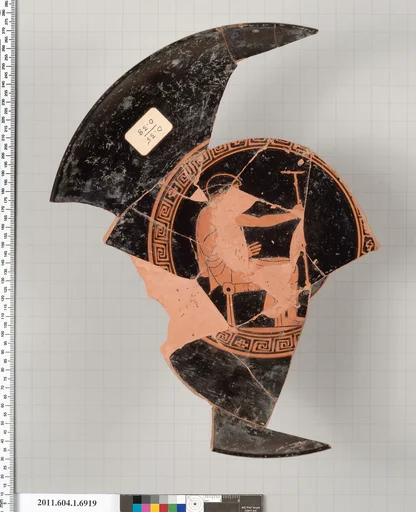 Terracotta fragment of a kylix (drinking cup)