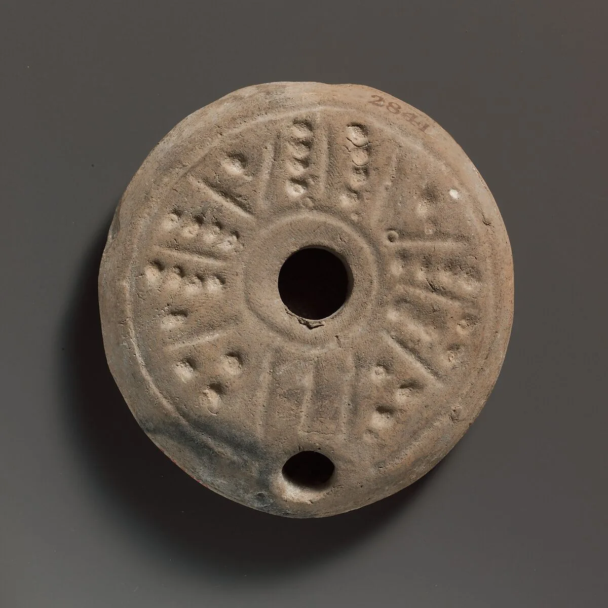 Terracotta oil lamp — Unknown