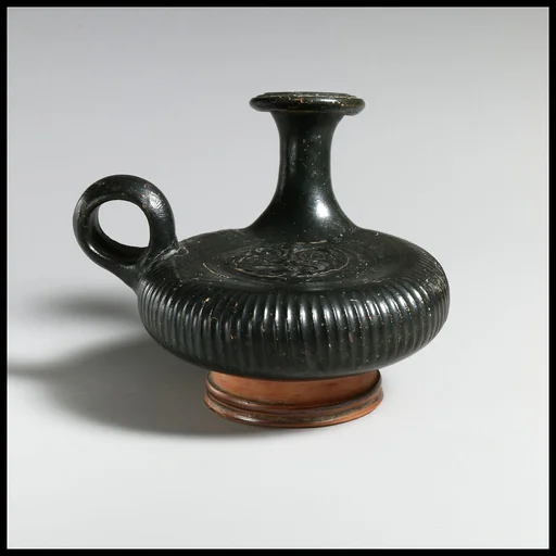 Terracotta guttus (flask with handle and vertical spout)