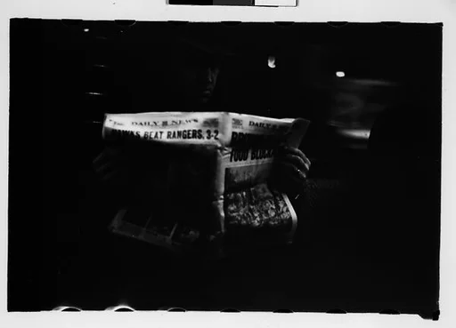 [Five 35mm Film Frames: Subway Passengers, New York City:  Woman, Man Reading Newspaper]