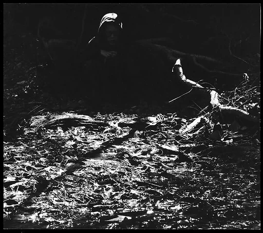 [Boy in Hooded Sweatshirt, Seated Outside]