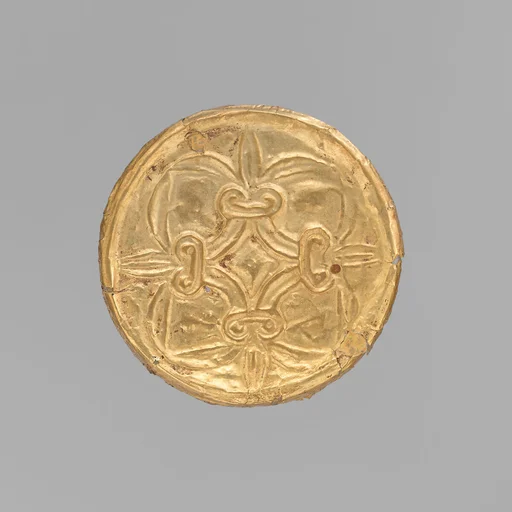 Gold roundel with stamped designs