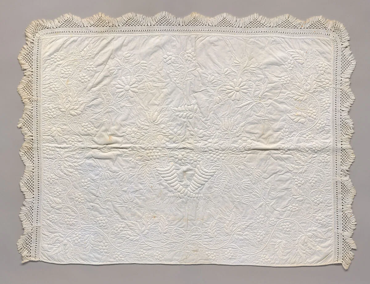 Stuffed and corded crib quilt — Unknown