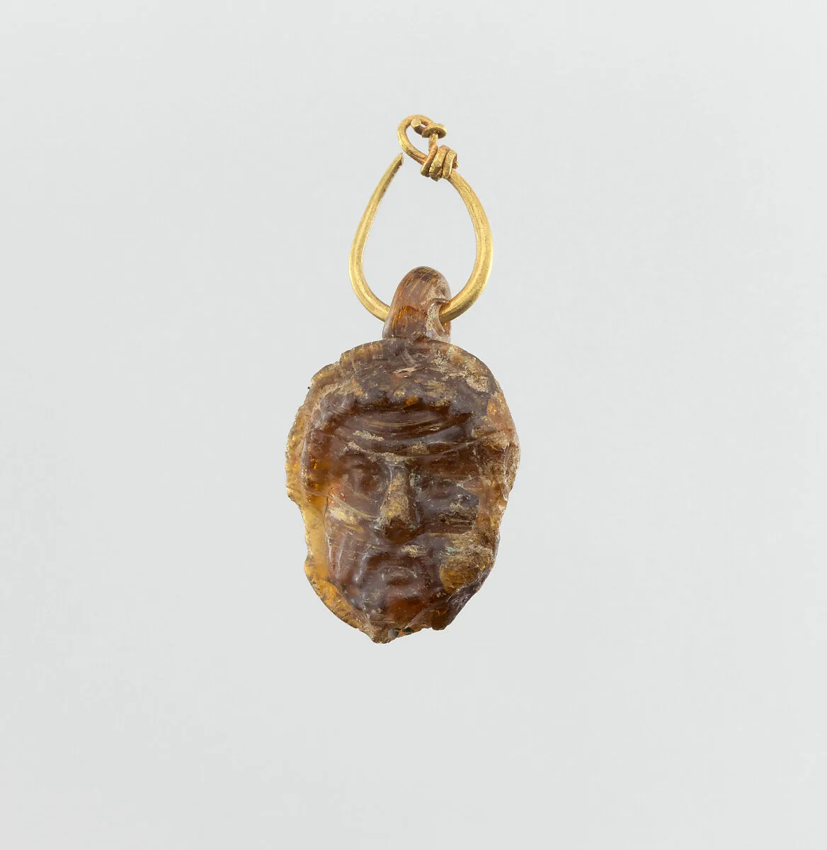 Glass double-headed pendant with gold hoop — Unknown