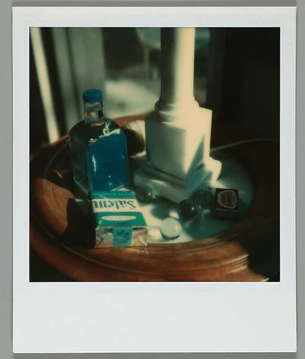 [Arrangement of Objects on Table: Cigarettes, Marbles, Matches]