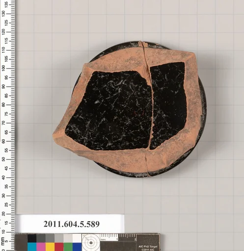 Terracotta fragment of a stemless kylix (drinking cup)