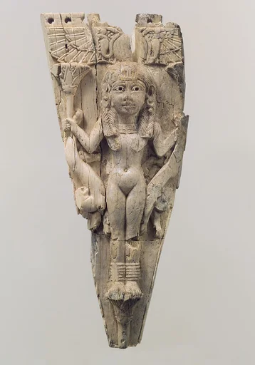 Horse frontlet carved in relief with a female figure flanked by lions
