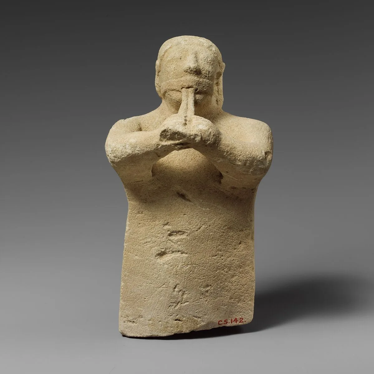 Limestone statuette of a male aulos player — Unknown