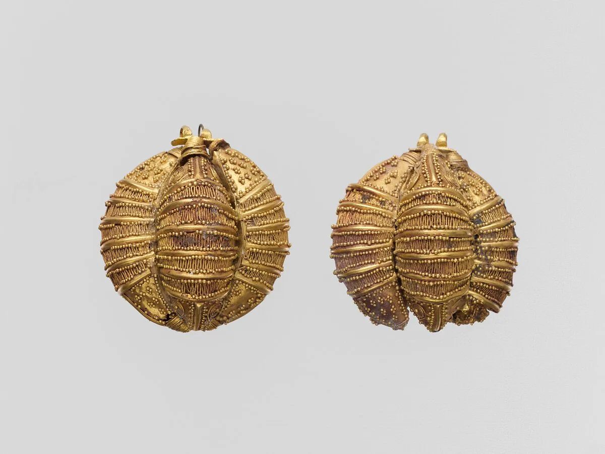 Pair of gold ornaments comprised of three leech-shaped elements — Unknown