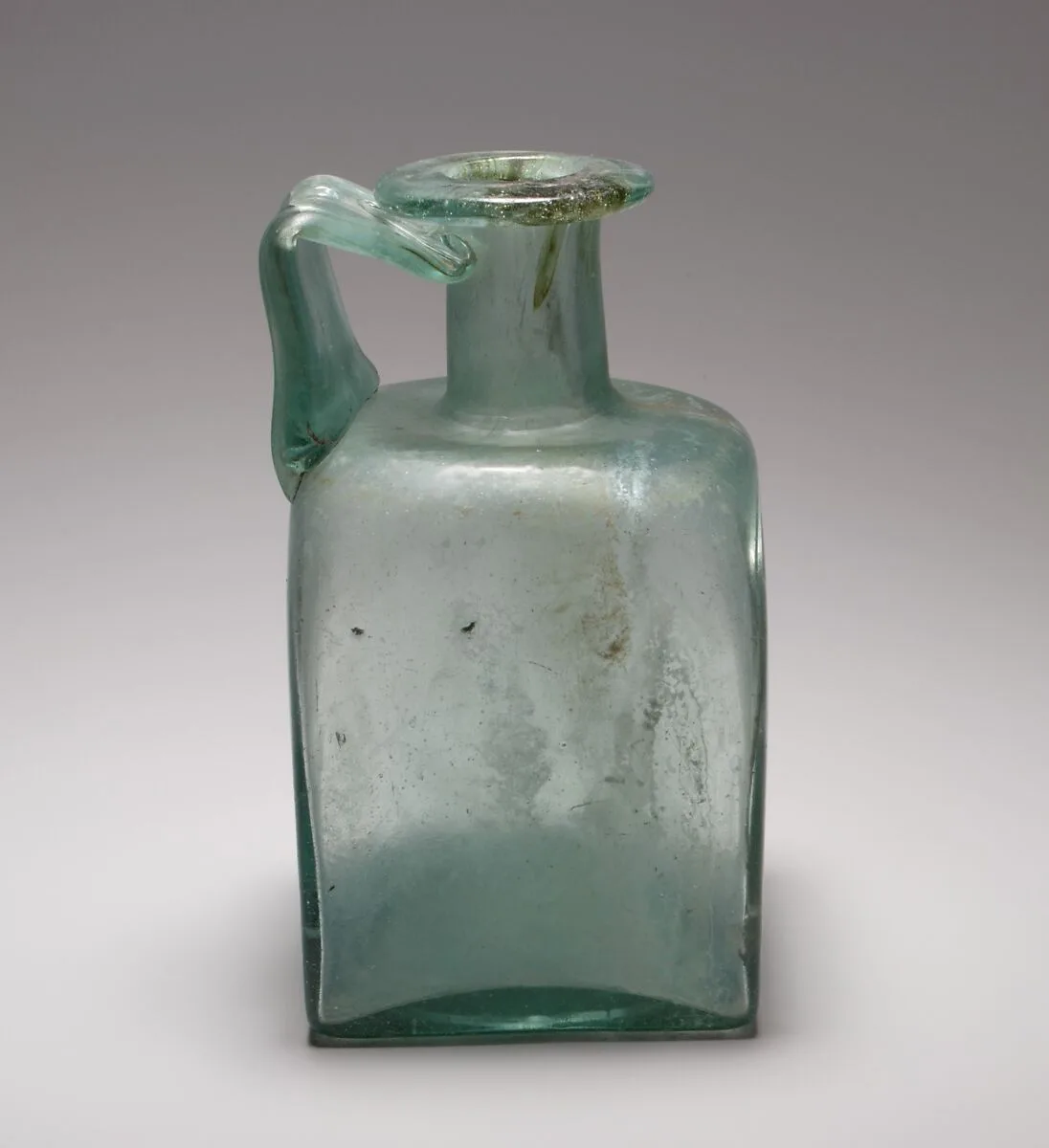 Glass square bottle — Unknown