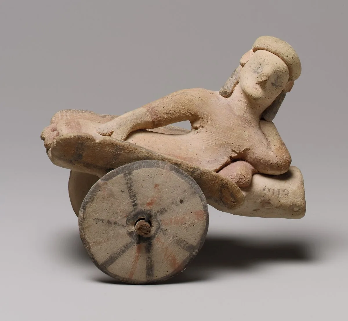 Model of a cart with a human figure — Unknown
