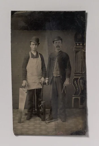 [Two Carpenters with a Handsaw, Wood Plane, Hammer, Compass, and Square]