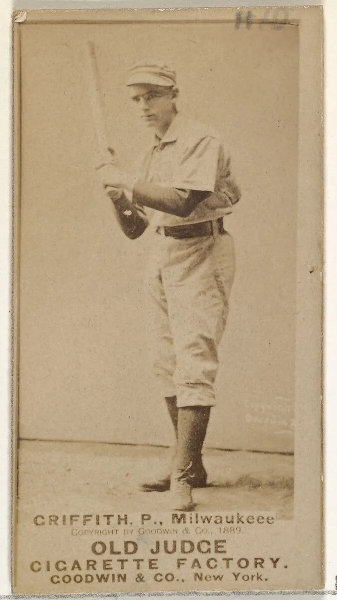 Clark Calvin "Old Fox" Griffith, Pitcher, Milwaukee, from the Old Judge series (N172) for Old Judge Cigarettes — Goodwin & Company