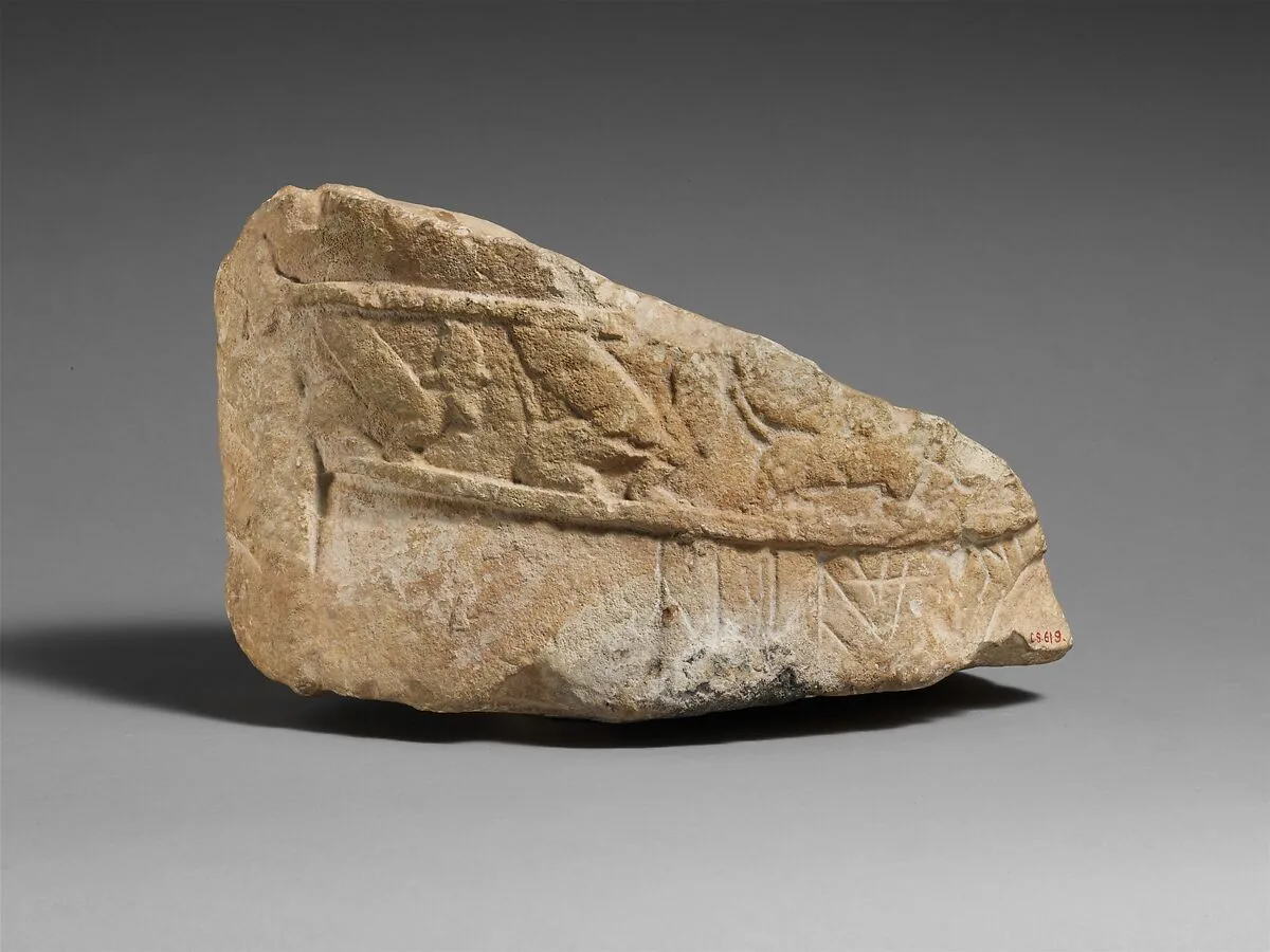 Fragment of an male limestone votary with an Egyptianizing kilt — Unknown
