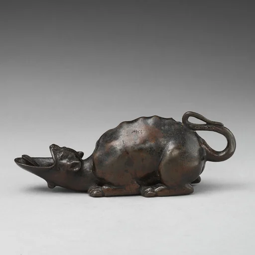 Oil lamp in the form of a grotesque animal