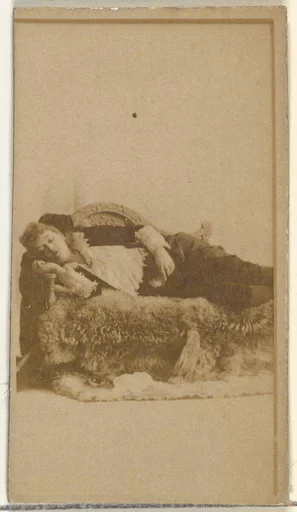 [Actress reclining on furs], from the Actors and Actresses series (N145-8) issued by Duke Sons & Co. to promote Duke Cigarettes