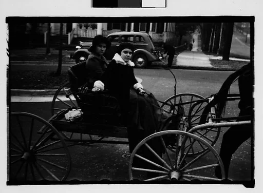 [Two Young Women in Horse-Drawn Carriage, Milledgeville, Georgia]