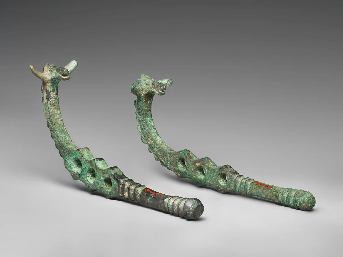 Horse bit cheekpieces in form of a horse with spiked mane — Unknown
