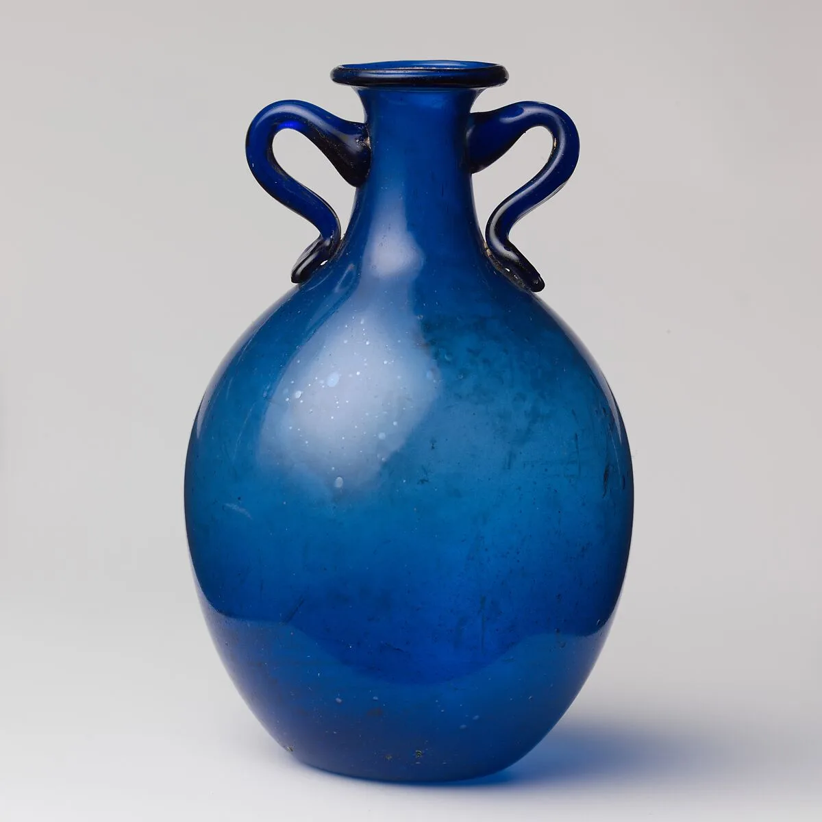 Glass two-handled bottle — Unknown