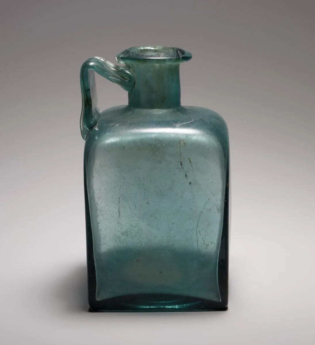 Glass square bottle — Unknown