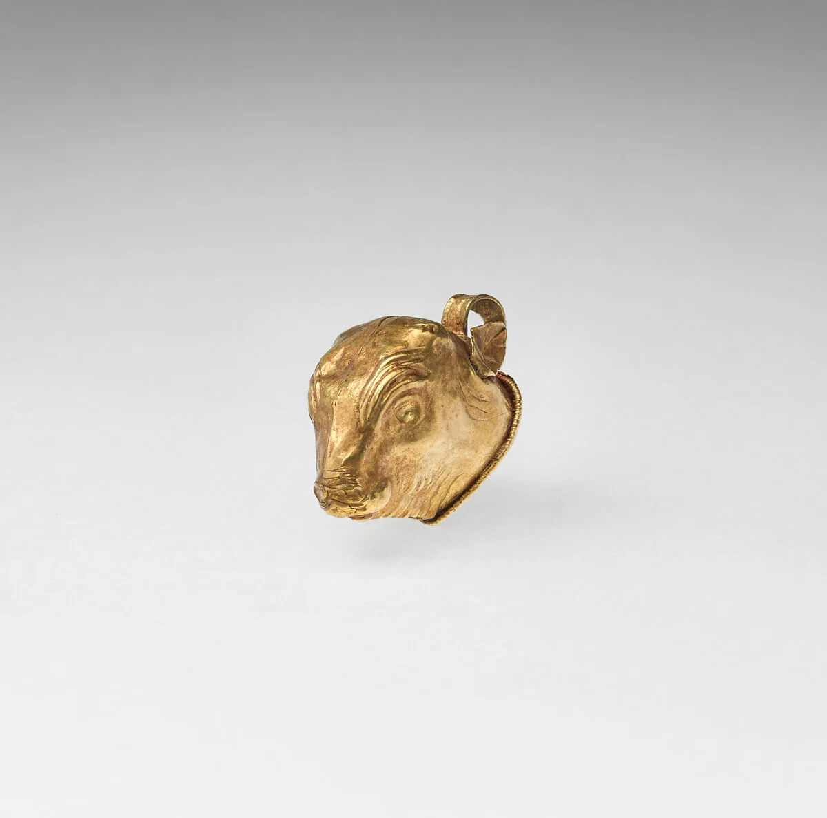 Gold calf-head pendant — Unknown