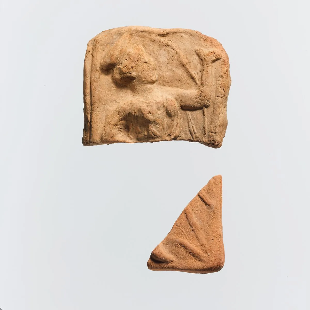 Two fragments of a terracotta plaque — Unknown
