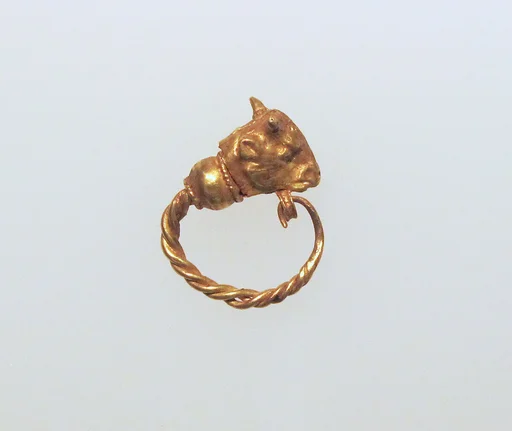 Gold earring with head of a bull