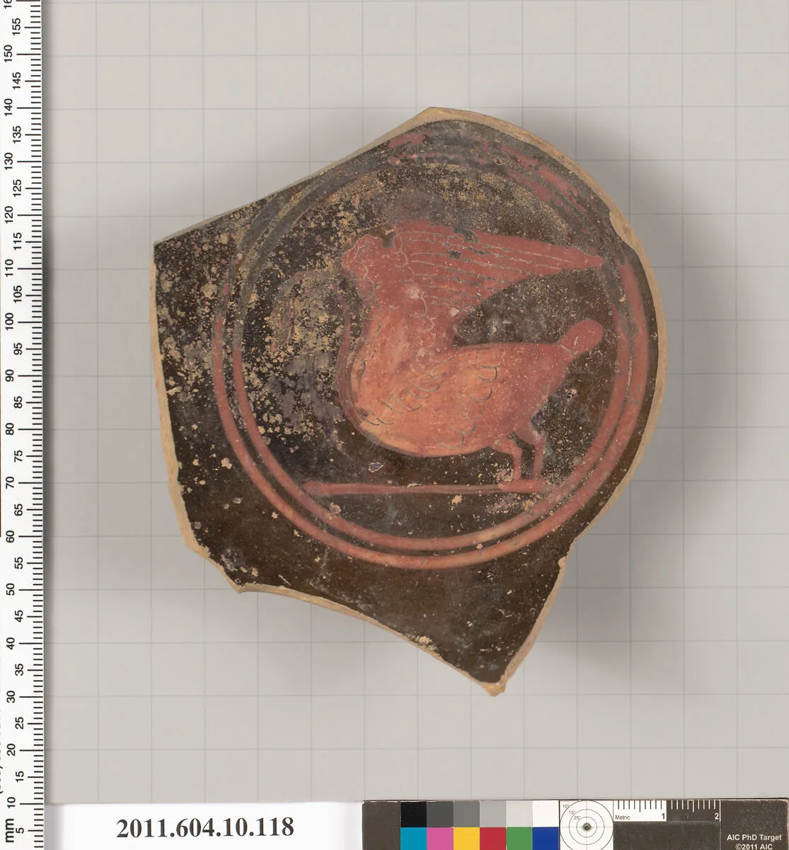 Terracotta fragment of a stemless kylix (drinking cup)? — Unknown