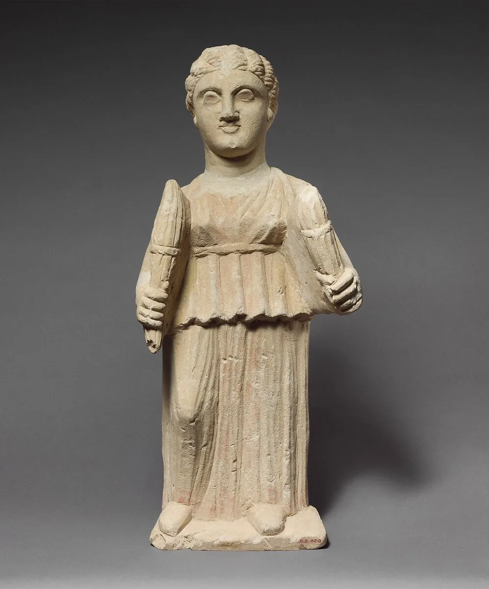 Limestone statuette of Artemis (?) holding two torches — Unknown