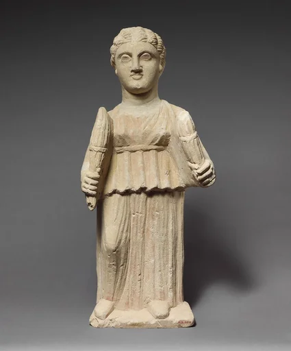 Limestone statuette of Artemis (?) holding two torches