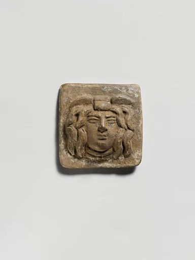 Terracotta relief plaque with head of Medusa