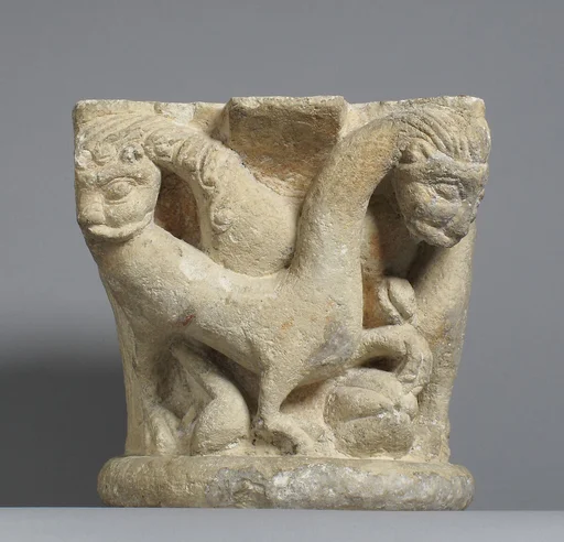 Capital with intertwining animals