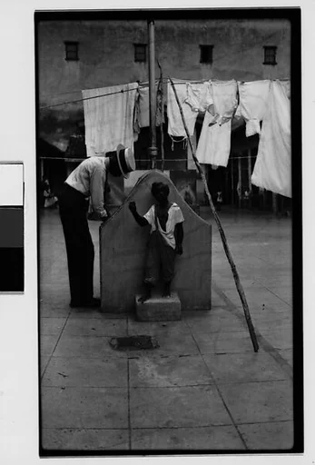 [Man at Communal Laundry in Courtyard, Havana]