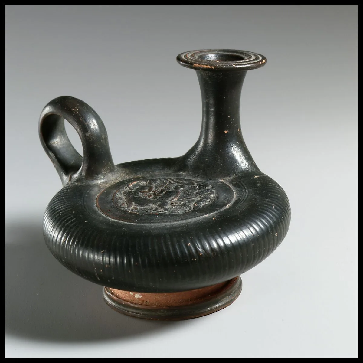 Terracotta guttus (flask with handle and vertical spout) — Unknown