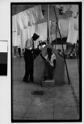 [Man at Communal Laundry in Courtyard, Havana]
