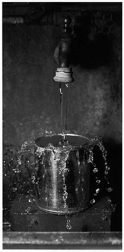 [Water Falling Unto Upturned Can]
