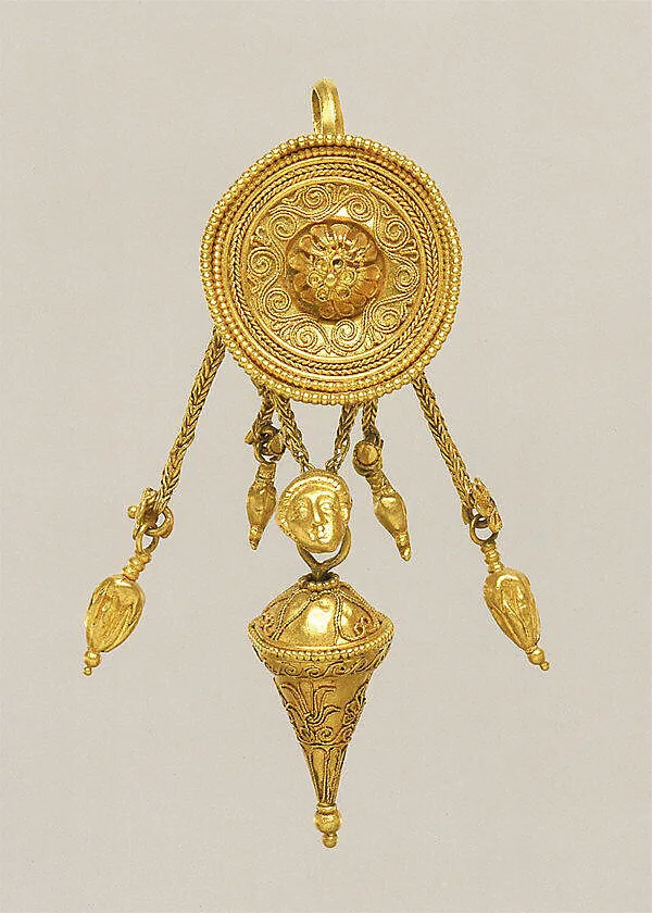 Gold disk earring with a female head and cone pendants — Unknown
