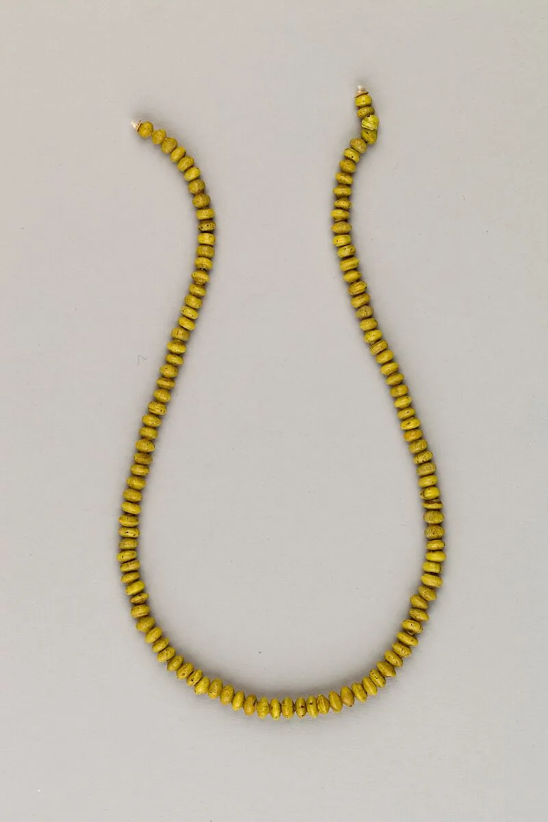 String of 115 discoid ridged beads — Unknown