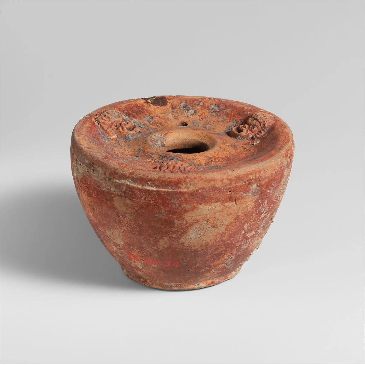 Terracotta inkwell and bronze stylus — Unknown