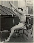[Male Model Posed Pulling a Rope in Anna Huntington's Rooftop Studio]